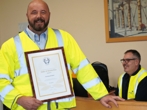 Jamie Grady, Production Operation Leader holding RoSPA Award